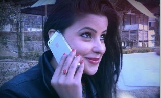 sushma-adhikari-talks-in-iphone_thumb.jpg