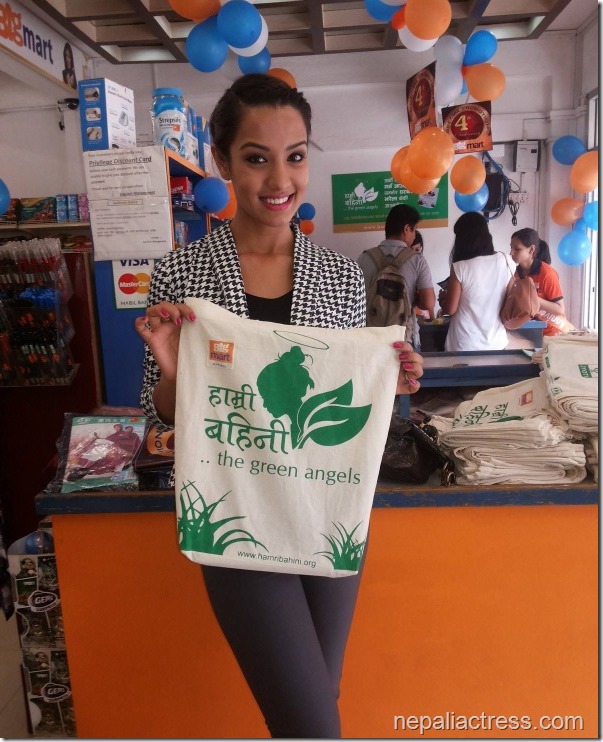 priyanka karki with green angels shopping bag