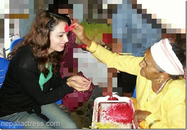 simpal khanal receives tika from grandmom